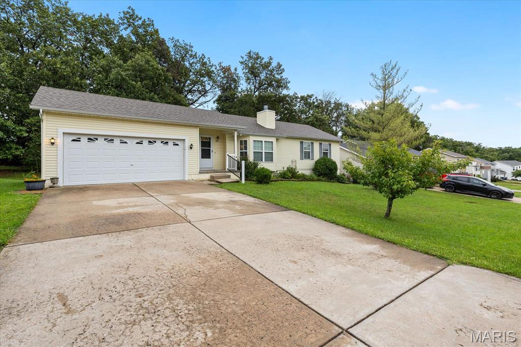 Welcome home! This charming 3-bedroom, 2-full-bath home offers comfortable main-level living with plenty of room to grow. Enjoy the convenience of main-floor laundry, a cozy wood-burning fireplace, and a spacious 10x15 deck overlooking the private backyard. The backyard offers a peaceful, park-like setting with mature trees and woods directly behind the property—perfect for relaxing, entertaining, or enjoying your morning coffee. The home also features a water softener, new roof, and 2-car garage. The full, unfinished basement provides an excellent opportunity to create additional living space, a home gym, office, recreation room, or whatever suits your needs. A wonderful combination of comfort, privacy, and potential!