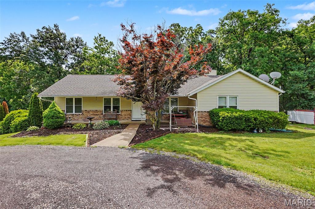 Welcome to this charming four-bedroom, three-bath home situated on three beautiful acres backing to woods in a quiet neighborhood in Wright City. This property offers the perfect blend of peaceful country living and everyday convenience, all while waiting for your personal touch to make it your own.

The main level features a spacious family room, dining area, and comfortable living spaces ideal for gatherings and daily living. The partially finished lower level includes a sleeping area and a cozy dinette space, offering additional flexibility for guests, entertaining, or a private retreat.

Surrounded by nature and mature trees, this property provides privacy, tranquility, and endless potential both inside and out. Come experience the possibilities this beautiful home has to offer.