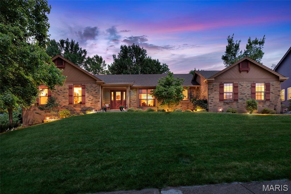 Welcome to a rare opportunity in the highly sought after Dietrich Oaks neighborhood, located within the acclaimed Parkway School District. Offering over 3,600 square feet of finished living space on a private .51 acre lot, this spacious ranch combines comfort, functionality, and the perfect layout for both everyday living and entertaining. A new concrete driveway leads to the oversized rear entry two car garage, providing abundant parking and added convenience for homeowners and guests alike. From the moment you enter, you'll appreciate the open, inviting feel of the home. The sunken living room serves as a stunning focal point, featuring vaulted ceilings, a wood burning fireplace, and durable laminate flooring that flows throughout the main living areas. Just steps away, the generously sized dining room is ideally situated between the living room and kitchen, creating a natural gathering space for holidays, celebrations, and family dinners. The heart of the home is the beautifully refreshed kitchen, featuring granite countertops, island seating, and ample workspace for preparing meals and hosting guests. The adjoining breakfast room provides additional dining space and offers direct access to the deck, where you can enjoy morning coffee or evening sunsets overlooking the peaceful backyard. A convenient main floor laundry room is located just off the kitchen. The spacious primary suite offers a true retreat at the end of the day, featuring a large walk-in closet and private bath with dual vanities and a custom walk-in shower. Large windows provide beautiful views of the backyard, creating a relaxing and serene atmosphere. Two additional generously sized bedrooms with new carpet and a full bath complete the main level. The finished lower level provides incredible flexibility and room to spread out. Whether you're hosting game day gatherings, movie nights, or accommodating guests, you'll love the enormous recreation room with bar area, separate family room, two additional bedrooms, and a full bath with walk-in shower. Two dedicated storage rooms provide plenty of space for seasonal items, hobbies, and organization. Outside, the beautifully maintained .51 acre lot offers exceptional privacy and room to enjoy the outdoors. The deck provides the perfect place to relax, entertain, or simply enjoy the peaceful backyard setting, while the in-ground sprinkler system helps keep the lawn lush and green throughout the season. With its generous living spaces, versatile floor plan, private setting, and unbeatable location, this is the kind of home buyers wait years to find. Spacious, welcoming, and thoughtfully designed for making memories, it's ready for its next chapter.