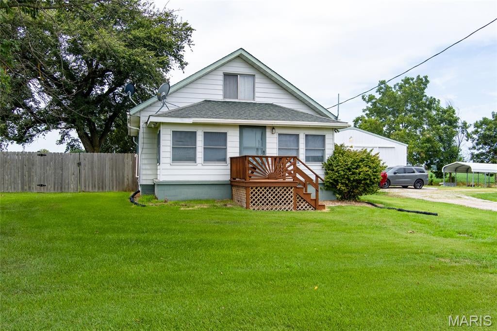 Motivated Seller! Over an acre here to love! Full main level bathroom offers a super fun clean bidet style. Don’t forget the ease and convenience of your very own laundry chute! One main level bedroom and two upper rooms or bonus room, one pass through to the next. Tile in the kitchen and YES, the appliances are staying for YOU! Office room, full basement, ample storage, walk-in closet, washer/dryer, additional kitchen flooring. Privacy fencing, chlorine pool with surrounding LED lights and patio high top table/umbrella/LED lights set. Approximately 45x37 Pole barn has its own half bath and shower kit bottom piece ready to pass to the new owner. Let’s Party - Outdoor bar and stools stay, along with the wood burning stove, fridge and carport. Previously on well water in 2020; which is still accessible should you choose. Outside city limits - Yet still close to town. Highly desired Mascoutah Schools. #GoIndians #PurplePride