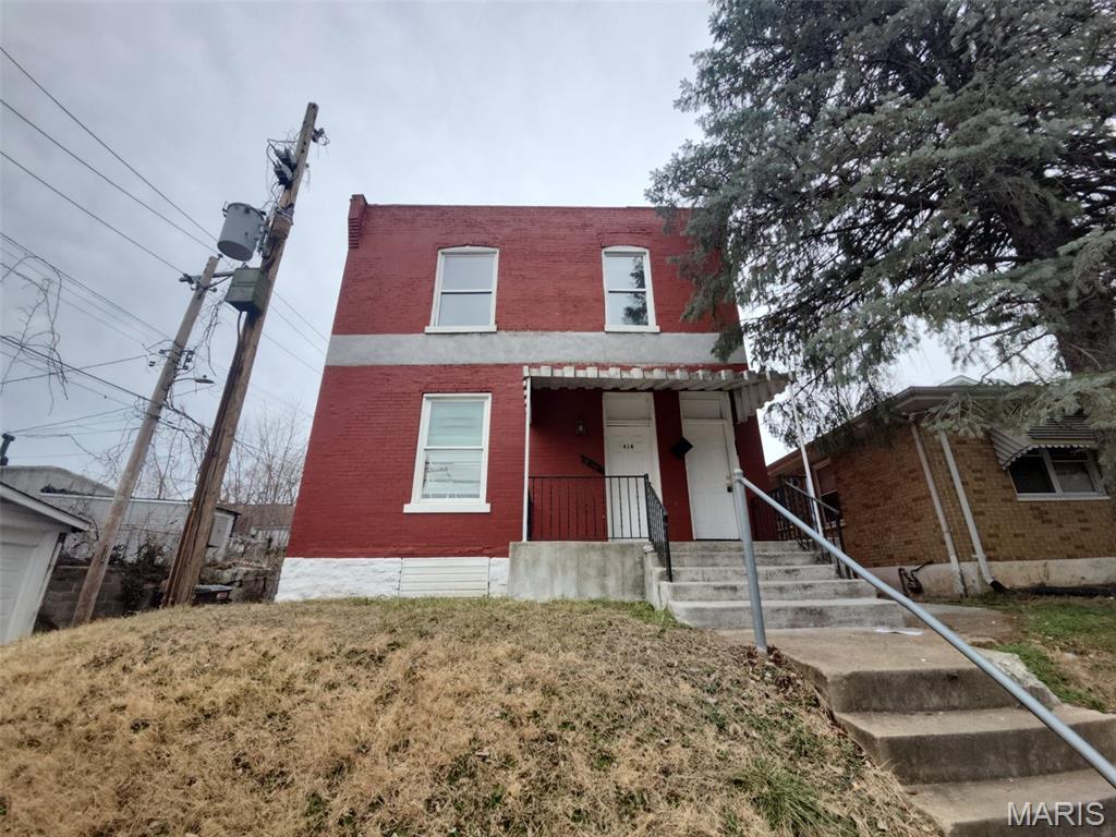 This brick two-family home in the Mount Pleasant neighborhood of South City offers a functional layout for an owner-occupant or an investor. Each level contains a unit featuring multiple bedrooms and a full bathroom. The exterior includes a large rear yard for outdoor activities. The property is located near public parks and local dining options, with straightforward access to transit and major thoroughfares. The residence is being sold in its current condition, and the seller will not provide for any inspections or repairs.