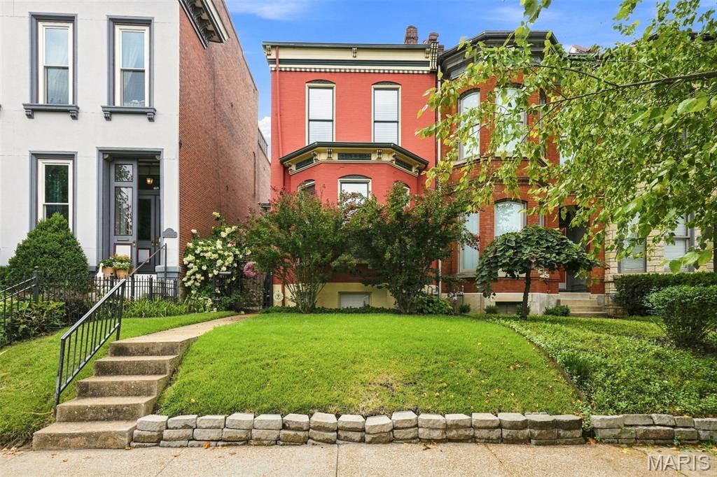 Welcome to 1923 S. Compton in the sought after Compton Heights neighborhood! You will love this beautifully preserved historic home, where classic architectural details meet the comfort of modern living. This two bedroom, 1.5 bath home boasts tall ceilings, original plank hardwood flooring & staircase, exposed brick, custom lighting, millwork and crown molding. Main floor has a spacious living room with 11 ft ceilings, gorgeous bay window and decorative fireplace. Eat-in kitchen has granite countertops, custom cabinetry and stainless steel appliances that leads to the light filled dining room. French doors off the dining room leads to private deck.  Half bath off of kitchen. Gorgeous original staircase leads to the second floor that has 10 ft ceilings. Spacious primary bedroom w/ fireplace and additional bedroom with private second story balcony, perfect for morning coffee! Full bath with jet tub and separate shower completes the second floor. Downstairs you will find the laundry area and lots of storage space. Outside you will find a deck- perfect for entertaining, well manicured lawn and two car garage. Great location! Close to restaurants, shopping, Tower Grove Park, Botanical Gardens, Lafayette Square