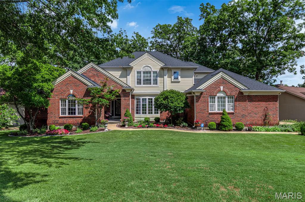 ** Open house is canceled for 04/26/2026 - Home is pending inspections and closing. **  Waterfront Living at its Finest! Updated Waterfront on Lake Saint Louis boasts a Two-Story Grand Entry Foyer with breathtaking entry door and gorgeous staircase. All new engineered wood flooring throughout the entire main level and all new LVP flooring in the entire deep pour atrium walkout lower level.  Main floor primary suite with zero entry custom tiled shower and a heated whirlpool tub, double bowl vanity, private water closet, and a large custom walk-in closet.  The primary bedroom also has an atrium door to a private waterfront maintenance free deck!  Great room with atrium windows with its lake views and balcony over the two-story spaciousness of the center of the home has a gas fireplace and a wet bar. Chef's kitchen with not one, but two Sub-Zero Built-In Refrigerators and a beverage center, Wolf Appliances with a six-burner gas stove with pot filler, double ovens, and a large center island breakfast bar defines the kitchen and kitchen dining space with a turret ceiling. The main floor also features a library or home office with French doors, a main floor laundry off the three-car garage, a formal dining room with ambiance lighting in the tray ceiling. There is a screened porch off of the kitchen and it extends to all of the maintenance free decks adorning the home. The finished walkout atrium lower level is a deep pour foundation ranging in ceiling heights from 9 feet to 11 feet with plenty of natural light pouring in from the windows. You'll find an entertainer's dream with large rec rooms and another wet bar with plenty of seating. The backyard requires no grass cutting, which allows for more time to enjoy the lake life!  Deep Water No Wake Cove, but not far from the main channel, and a Concrete dock with boat lift is included, as well as an updated seawall, two updated HVAC systems, and the architectural roof is only 6 years old.  Move-In Ready to start enjoying your Lake Life!  Boat to The Dam Bar and Concerts on the Lake.