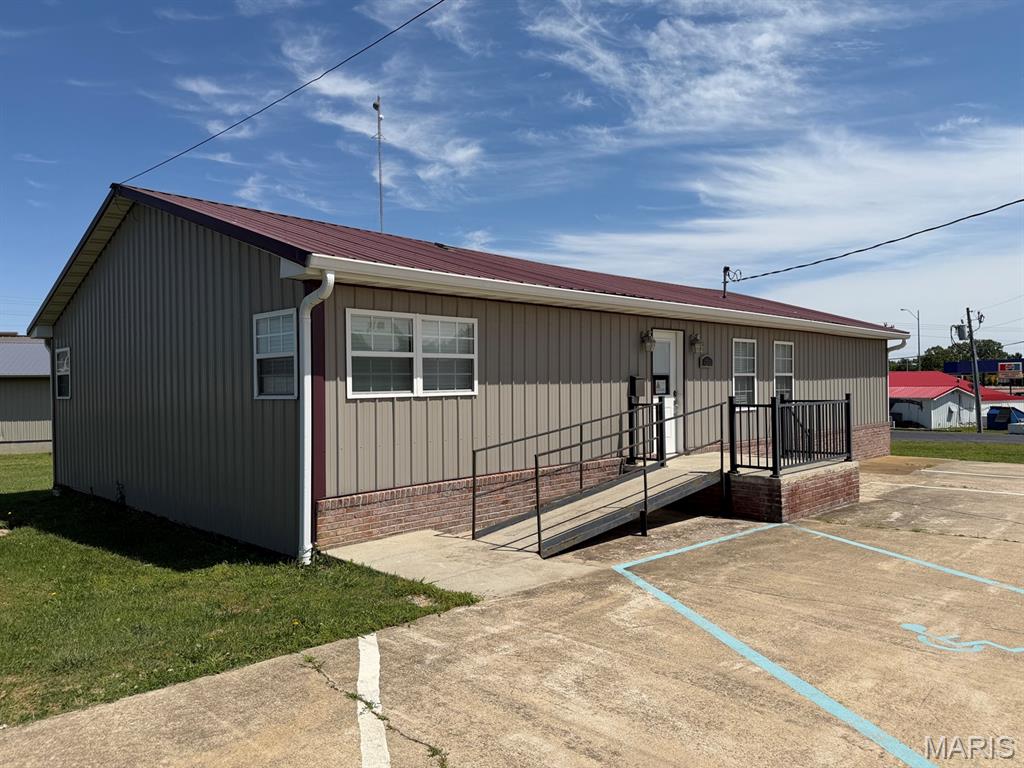AGENT OWNED PROPERTY.  This building was used as an office for Real Estate and Insurance Sales.  Can be used for any commercial office buyer chooses to put in it.  Building consists of 3 offices, Reception area, full kitchen, storage room, storage closet, and a full unfinished basement for storage as well.  Parking spaces are marked as well.