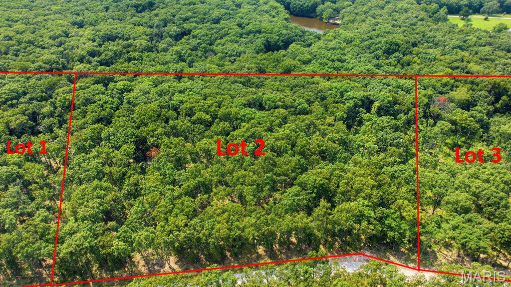 3 Beautiful wooded acreage located just minutes from I-70 and conveniently situated just off blacktop frontage. This peaceful property offers the perfect setting to build your dream home or barndominium while enjoying privacy, nature, and easy access to nearby amenities. Lots range from approximately 3 to 5 acres and are subject to minimal restrictions. No mobile or modular homes, junkyards, or hog farms are permitted. Cuivre River Electric will be available upon completion of engineering and installation by the developer. Each lot will require a private well and septic system.