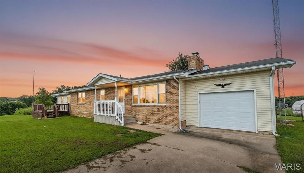 Country living with room to breathe, just minutes from I-44. This well-maintained 3 bedroom, 2.5 bath ranch sits on 1.75 acres with open views, and the current owners have given it a fresh, updated feel throughout. Beautiful new luxury vinyl plank flooring and fresh paint run through the living areas and all three bedrooms, so the spaces feel bright, clean, and ready for you to move right in. Cozy up to the wood burning stove in the living room on chilly evenings, then enjoy morning coffee on the large covered back patio while you take in the peaceful country setting. The kitchen offers custom cabinetry, a breakfast bar, and a separate dining area with sliding doors to the patio. You will love the extras here: a full walk up basement with a half bath and endless workshop and storage space, a bonus room with its own private entrance and porch that is perfect for a hobby room, home office, or studio, an attached garage. Well and septic, central air, and quick highway access to Rolla or St. James. Homes with this much space, land, and flexibility do not come along often. Schedule your private showing today.