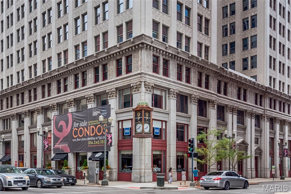 The historic Marquette building is the crown jewel of downtown living! Blocks from Busch Stadium, the Edward Jones Dome & The Arch!  Live in luxury with door attendant, Carrera marble lobby, rooftop pool & sun deck, pet park, BBQ terrace, bike storage, dry cleaning service, secure covered parking, & more! Convenient to MetroLink & all downtown St. Louis has to offer. This 2 bedroom, 1.5 bath home is a corner unit and the original display.  It has great urban views overlooking downtown St. Louis and even has a glimpse of the river. You’ll find the features that discriminating buyers are looking for: hardwood floors, granite counters, stainless steel appliances, in-unit w/d & master bedroom suite w/ walk-in closet. The seller has added electric blinds throughout & new carpet in 2024, a new heat pump in 2025 and pull out shelves in many of the kitchen cabinets. Storage & attached garage parking included. Walk to Cardinal games or Ballpark Village! Call today to find out more!