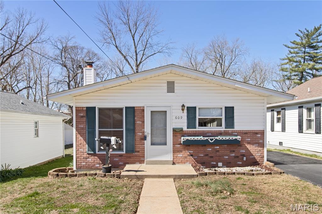 Charming, well-maintained home with quality throughout! Features beautiful hardwood floors and a bright open living/dining combo with classic wood shutters. The kitchen offers custom cabinetry, ample storage, and appliances included. Side entry from the driveway leads to a partially finished lower level—ideal for a second living area, guest space, or storage—with laundry hookups. Main level includes 2 bedrooms with spacious closets and convenient main-floor laundry. Enjoy the level, fully fenced backyard—perfect for pets or outdoor activities. Located in Festus, known for it's small-town charm. Seller has limited knowledge of the property, has never occupied it, and is selling AS-IS.