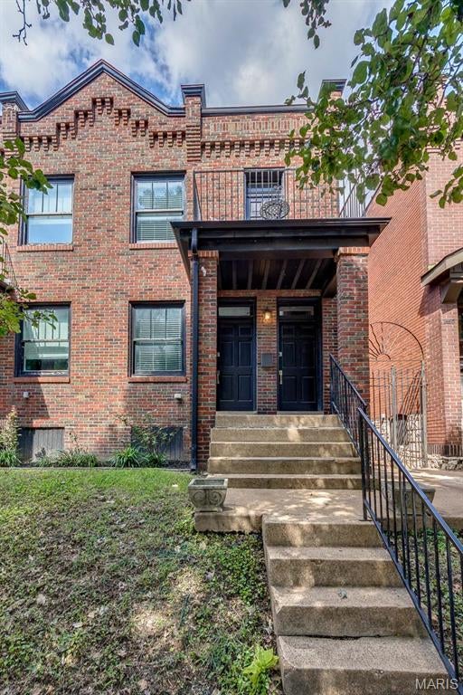 Historic character meets modern city living in this move-in-ready 3BR/2.5BA townhouse offering 1,660 sqft in St. Louis’ historic Benton Park neighborhood. The open main level pairs exposed brick, crown molding and wood floors with a striking glass stair wall. The spacious kitchen offers granite counters, abundant cabinetry, stainless appliances, gas range and seating for four, plus convenient main-floor laundry. Upstairs, step onto the front balcony for a one-of-a-kind view of the iconic Lemp Mansion directly across the street. The primary suite features a walk-in closet, dual sinks and walk-in shower with two shower heads. Out back, enjoy a private patio and coveted off-street parking for two cars. Walk to Cherokee Street/Antique Row, Mud House, Saturn Lounge, Bluewood Brewing and neighborhood favorites with Soulard and Downtown just minutes away. City living, without giving up space, style or parking!
