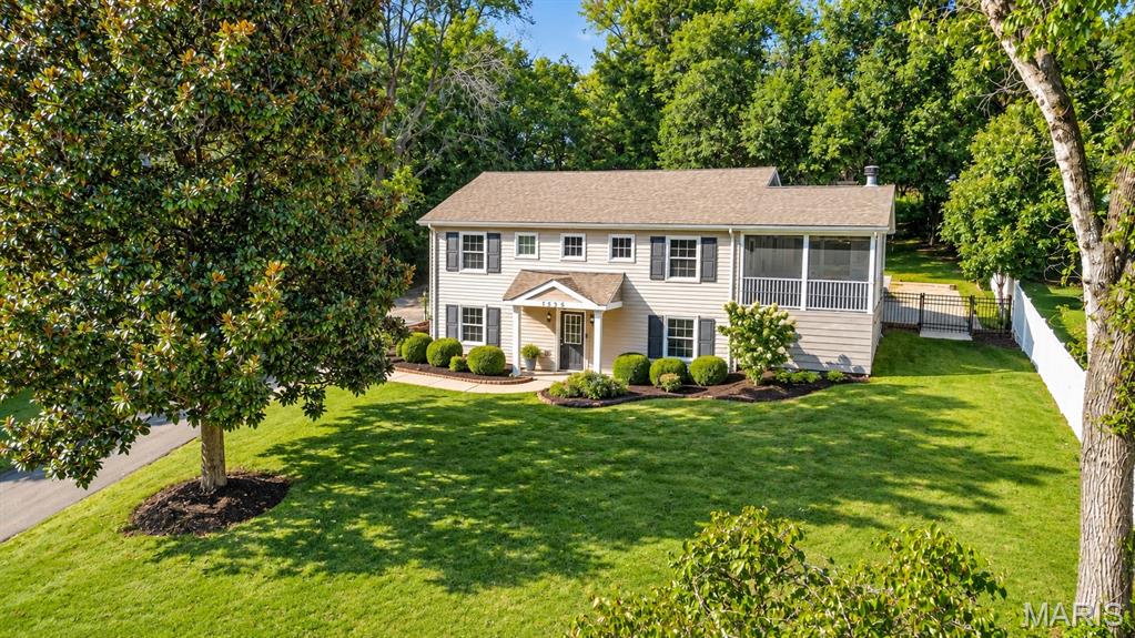 Welcome to this lovely Kirkwood home, nestled on over half an acre - a rare find in this part of town! The upper level offers a spacious family room filled with windows and natural light, flowing seamlessly into the kitchen and dining area. The kitchen features stainless steel appliances and abundant cabinetry and is perfectly positioned between the family room and a wonderful mudroom. With walls of cabinetry and plenty of space to keep everyday life organized, the mudroom is an exceptional “catch-all” space that is hard to find.

Also on this level are two bedrooms, a full bath and a truly special screened-in porch. Complete with a fireplace and plenty of room to relax with a book or gather with friends, this inviting space is sure to become a favorite spot throughout the seasons.

The main level offers a spacious primary suite along with an additional room that would make an ideal home office, gym or flex space. There is also abundant unfinished space, providing excellent storage options.

Step outside and discover a park-like rear yard with endless possibilities. Currently offering a patio, off the screened in porch and a nice firepit with a seating area, but with over half an acre to work with, there is plenty of room to create the outdoor spaces you've always envisioned. An oversized two-car garage completes this wonderful Kirkwood charmer!