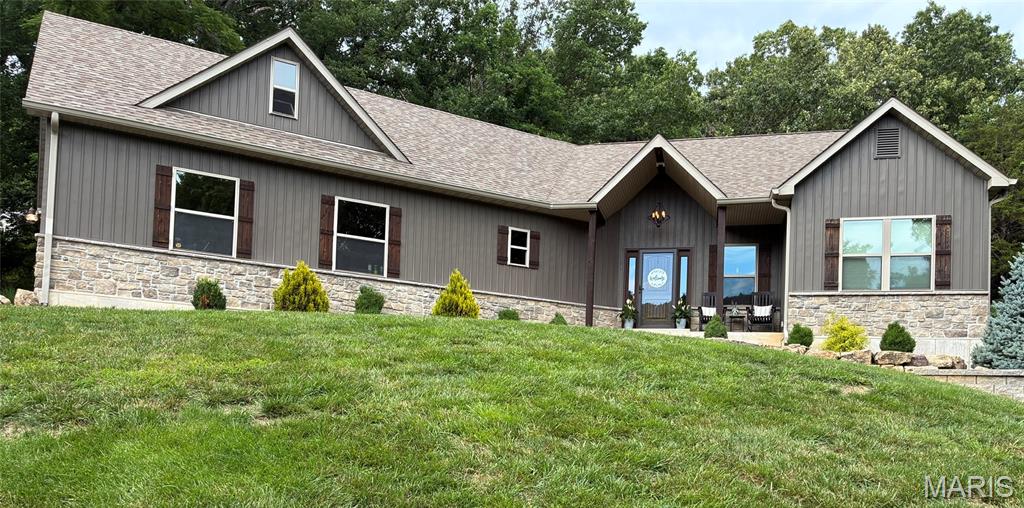 Tucked away on over 3 acres, this custom ranch offers the rare blend of space, privacy, and convenience you have been searching for. With over 4,000 finished sq ft, 4 bedrooms, and 3.5 baths near Seckman High School, shopping, and major highways, this move-in-ready home is designed for everyday living and entertaining. The open-concept floor plan is filled with natural light and features a custom kitchen with granite countertops, stainless steel appliances, custom cabinetry, and walk-in pantry. The finished walkout lower level includes a fourth bedroom, full bath, and spacious family room. Relax on the covered patio overlooking peaceful wooded views. A 700 sq ft garage, custom built storage shed and bonus room complete this exceptional property. Schedule your showing today!