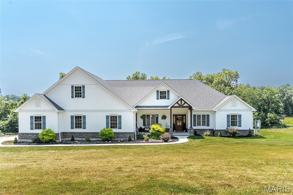 Welcome to country living at its best! This beautiful 2022-built ranch sits on 12 scenic acres in New Haven, offering 3 bedrooms, 3.5 baths, 3,064 square feet of comfortable living space, plus a convenient office/den on the main level. The open floor plan features custom cabinetry, granite countertops, a large kitchen island, walk-in pantry, and plenty of space to gather with family and friends. Two fireplaces add warmth and character to the living spaces, while the full walk-out basement with 9+ foot ceilings provides endless possibilities for future living space, a workshop, recreation room, or storage.

Outside, enjoy gently rolling, cleared acreage with a beautiful mixture of open pasture and woods, offering peaceful views, privacy, and plenty of room to roam. A barn/outbuilding provides additional space for storage and the possibilities that come with acreage. Whether you're looking to enjoy the land, relax in a peaceful country setting, or simply have more room to spread out, this property offers a wonderful combination of modern comfort, usable acreage, and rural charm—all just outside New Haven