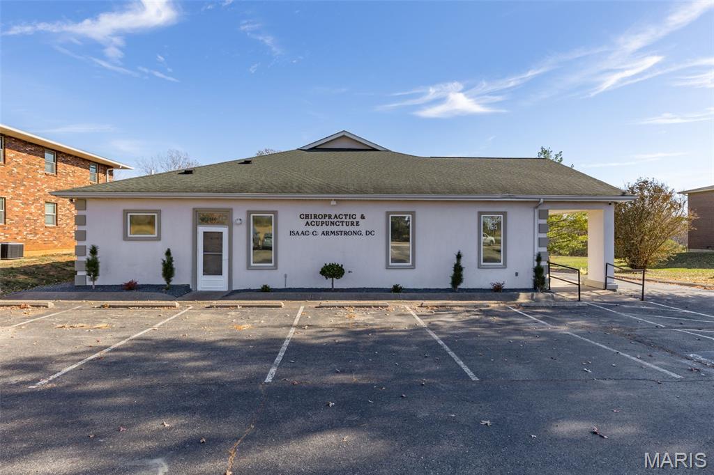 Property is currently operating as a chiropractic office with a portion leased to a hospice organization. This well-maintained commercial building offers over 4,000 sq ft of finished office space designed for medical or professional use. Interior features include multiple private exam rooms, a dedicated reception desk, a spacious waiting area, and two bathrooms. The exterior provides 11,200 sq ft of asphalt parking. 

The back portion of the building is currently leased to a Nursing/Hospice Company. The lease space is 35% of the finished square footage with its own entry and exit. This portion of the building also has its own address and parking spaces, generating reliable rental income. 

Additional property highlights include:    
   •   Excellent visibility and high-traffic location
   •   Zoned for commercial/office use (verify with municipality)
   •   All city utilities available (water, sewer, electric, and internet)
   •   Well-maintained structure suitable for immediate occupancy
   •   Ideal for medical, therapy, professional offices, or investment purposes