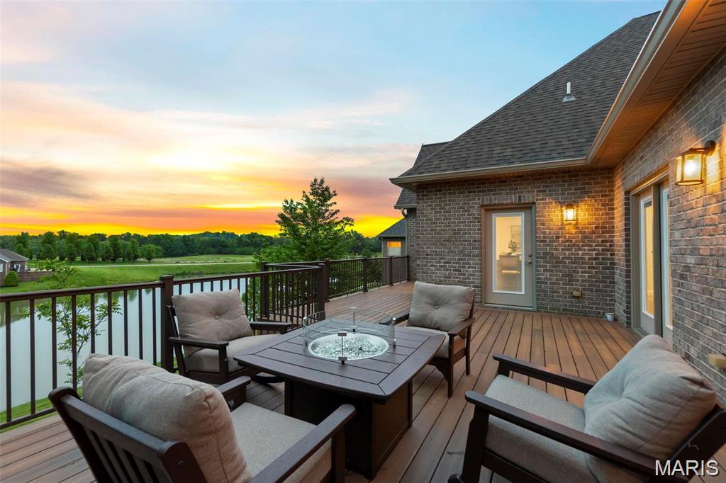 Nestled in a quiet cul-de-sac in desirable Dalhousie subdivision, this exceptional lakefront home offers breathtaking views of both the lake and the Dalhousie Golf Course. The spacious open concept floor plan is designed for comfortable living and effortless entertaining, with expansive windows and direct access to a large deck showcasing the stunning scenery. With over 5,000 square feet of living space, there is plenty of room for gathering and entertaining. The main level primary suite features picturesque lake views, its own access to the deck, a deluxe bath set up, and an impressive walk in closet.
The finished walkout lower level includes a newly remodeled entertainment area complete with a custom bar and large screen viewing space, perfect for game days, movie nights, and hosting guests. Basement also provides great office space! Step outside to the covered patio and the newly fenced backyard, ideal spots for barbecuing and relaxing. 
An upper level bedroom and private bath provide excellent separation and flexibility for guests, a home office, hobby space, or additional living quarters. The unfinished area even features a painted pickle ball practice court, offering a unique recreational opportunity right at home. The roomy two car garage has a hypoxied floor and accomodates large vehicles well.  This home is a rare combination of space, views, and amenities in one of Cape Girardeau's most sought after locations!