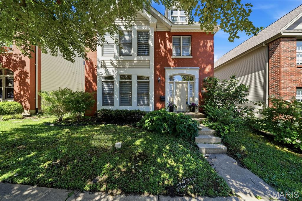 Gorgeous 2-story home located in the desirable Village of University Place! This beautifully maintained property offers an open floor plan with tons of windows throughout, filling every room with an abundance of natural light. The main floor features a spacious living room with a cozy woodburning fireplace, separate dining area with new patio doors (2026) leading to the newer backyard concrete patio (2026), and a large eat-in kitchen perfect for entertaining. The kitchen boasts tons of wood cabinetry, newer granite countertops (2023), a center island, and newer stainless steel appliances (2023).  Upstairs, you’ll find 3 generously sized bedrooms, including an oversized primary suite with vaulted ceilings, new canned lighting (2025), an organized walk-in closet by St. Louis Closet Company (2026), and a spacious ensuite bath featuring a separate shower and soaking tub. The partially finished basement provides additional living space along with a large storage room. Additional updates include a newer French drain system (2025) and a new sump pump with check valve (2026). Situated in a walkable community close to popular local restaurants, boutiques, and amenities, this move-in-ready home offers the perfect blend of comfort, style, and convenience. Schedule your private showing today!