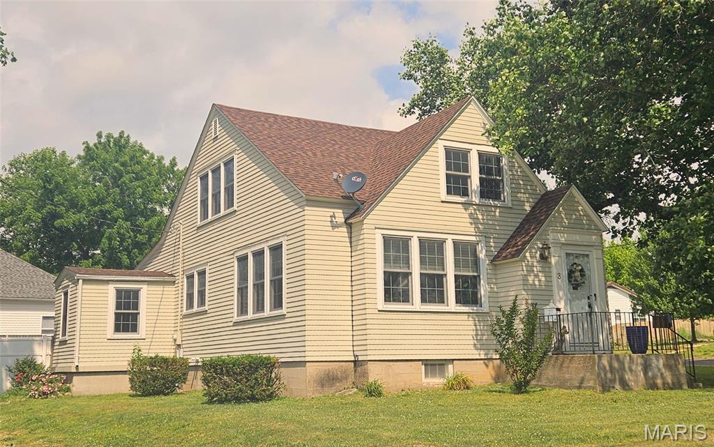Step into timeless charm with this delightful Craftsman-style story-and-a-half home, where character and comfort blend beautifully. Sunlight pours through generous windows, highlighting rich wood floors, soaring ceilings, and classic built-ins that add both style and function throughout.  The inviting living area centers around a cozy woodburning fireplace w/blower that was installed in approximately 2022/2023, creating the perfect gathering space, while an additional sitting room offers flexibility for relaxing or entertaining. The stunning kitchen is truly a standout—warm, welcoming, and designed for everyday living with ample cabinetry and workspace.  All appliances stay including microwave that was installed in 2025. With 3 spacious bedrooms and a versatile upstairs bonus room ideal for a nursery, office, or creative retreat, this home adapts effortlessly to your lifestyle. 2 1/2-bathrooms.  The main-floor primary suite provides convenience and privacy, with direct access to a charming screened-in porch—your own peaceful escape for enjoying summer evenings. Outside, a privacy-fenced backyard and 2-car detached garage add both function and appeal, while the full unfinished basement offers incredible storage or future expansion potential.  New Roof installed in 2025.  Situated on a corner lot in town, you’ll enjoy easy access to local amenities, all while being just a scenic 30-minute drive to the crystal-clear waters of the Current River and Montauk State Park.   This is more than a home—it’s a place to live, relax, and make lasting memories.