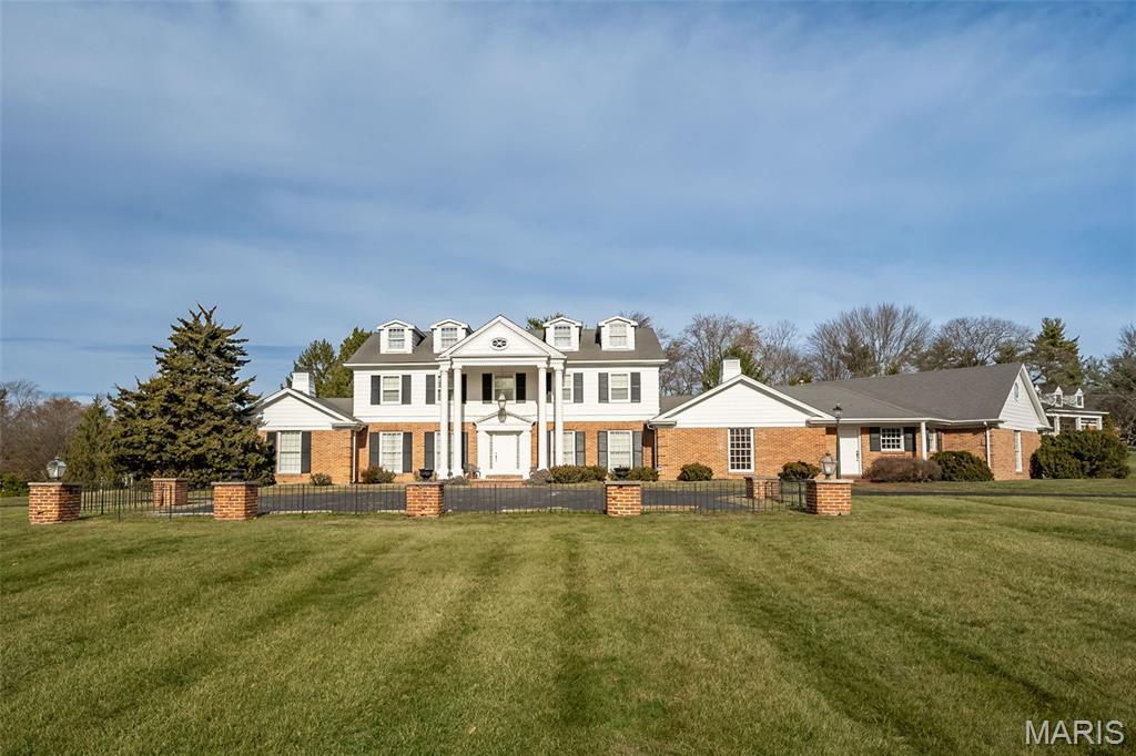 Exceptional craftsmanship & distinctive design elements are featured throughout this Higgenbotham-built Georgian Colonial in prestigious Muirfield.  2-Sty marble foyer highlighted by flared staircase leads to formal living & dining rooms & spacious family room with beamed ceiling, floor-to-ceiling brick fireplace & mirrored display case. Chef’s kitchen with oak cabinetry, 7’ center island, convenient planning center & wine cellar adjoins vaulted breakfast room. A well-appointed den & adjacent office with private entrance provide additional living space. The primary bedroom suite offers an appealing retreat with 2 walk-in & 2 double closets & expanded bath with jetted tub. Oak staircase accesses 3 generous-sized bedrooms, 2 with ensuite baths & 1 with Jack n’ Jill bath, & library-paneled study. Lower Level includes “Victorian hotel” inspired family room, recreation room with wet bar, game room, sitting room & full bath. Situated on a parklike 1.77-ac lot with patio, pool & pool house.