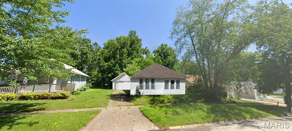 Solid 2-bedroom ranch home in Macomb, IL, featuring a newer roof, detached garage, and a spacious backyard, all surrounded by well-kept homes in a nice neighborhood. Value priced well below market, this property is perfect for investors seeking monthly rental income, future profits, or a private residence with room to grow. Exterior viewing only—no interior showings or photos available. The home is vacant and being sold as-is, cash sale only, with no contingencies accepted. An updated RPR report may be provided upon request. Buyer or Buyer's agent responsible for verifying MLS info.