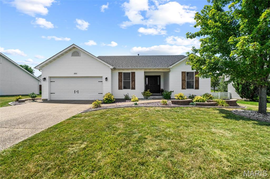 Get ready to fall in love with 202 Schmittgens Dr! Nestled in the highly desirable Stone Meadows community, this beautifully maintained ranch offers comfortable main-level living, an open and inviting layout, and recent improvements that make this one truly move-in ready. Step inside to find a bright, welcoming living space with vaulted ceilings and an easy-flow floor plan that's perfect for everyday living and entertaining. The spacious kitchen offers plenty of cabinetry, generous counter space, and a seamless connection to the dining and living areas, making gatherings effortless. The primary suite is a standout, featuring a beautifully remodeled en suite bathroom completed in June 2026 that brings a fresh, modern feel to your private retreat. The finished lower level adds valuable living space with a large family room, cozy fireplace, and plenty of room for a home office, gym, playroom, or movie nights. Outside, the updates continue. Enjoy fresh landscaping completed in September 2024, brand-new stairs leading to the backyard patio completed in September 2025, new siding installed in March 2026, and a brand-new roof completed in November 2025. And let's talk location because it's hard to beat. Ownership includes access to two neighborhood pools, perfect for soaking up summer without the maintenance. Plus, a daycare, elementary school, middle school, and Timberland High School are all within approximately one mile, making everyday routines incredibly convenient. Stone Meadows also offers fantastic neighborhood amenities including a clubhouse and community recreation areas. Stylish updates, major improvements, incredible neighborhood amenities, and an unbeatable Wentzville location—this is the one buyers have been waiting for. Skip the projects and start enjoying home from day one!