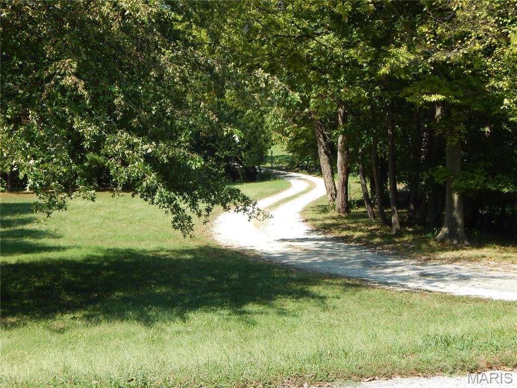 House and 2 lots with a total of 2.29 gorgeous acres appr. at 1475 Uthoff (house) and 1435 Uthoff (additional lot) in the Rockwood School District plus a unique combination of features you're not likely to find again! Walk one long block south to Uthoff Valley Elementary or one block the other way to the trail at Fabick Conservation area connecting to the Riverchase YMCA Receation / Water Park facility or fishing at Preslar Lake. The lot at one point is actually adjacent to the Conservation area and there is something about it that reminds of an old farm. This is a place you can beat the grocery store and grow a lot of your own food. Soon it will be time to harvest walnuts that will drop from at least several mature trees. A pond also. It needs help at this time but it seems like it could be made beautiful again and it might even be spring fed. I could go on  and on but you just have to see it for yourself! The house will not be shown until it is unuccupied. Probably less than 20 days. More will be known about that by 9/30. The seller is POA for the owner so there is a lot that is not known about the property.  I have not been in the house or have any information about what it's like.