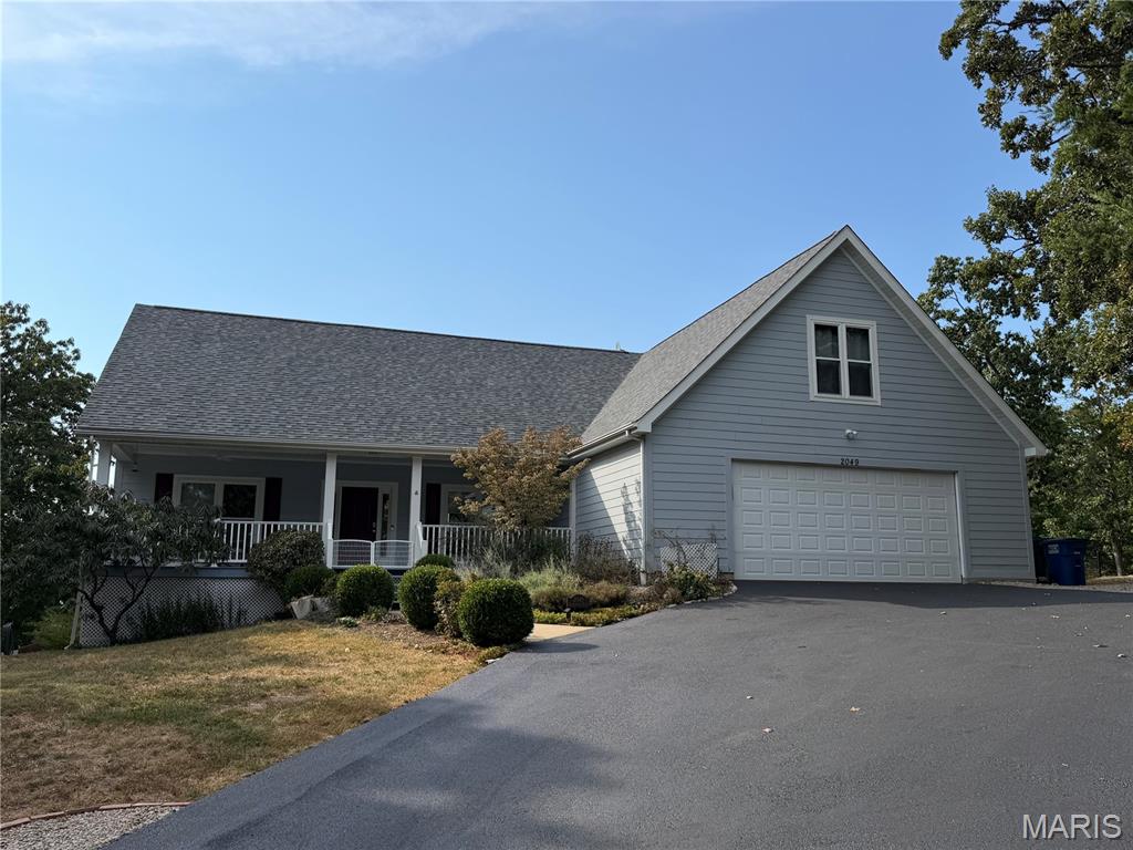 2049 Tanglewood Dr, Pacific, MO — Country Club Estates
Private 1.5-story home on 2.7 acres with hill views, walking trails, and a finished walk-out lower level.
Freshly sealed blacktop leads to an oversized 2-car garage with an 8-foot insulated door and off-street parking for 10–15 cars. A large covered front porch with new fans sits at the entry.
Inside, the foyer opens to tall, vaulted ceilings through the great room, dining room, and kitchen. A wall of windows looks out over Pacific’s rolling hills and sunsets across your own land. Hardwood floors run through the main living areas. The home has been freshly prepped and painted, and the side entry was replaced with an energy-efficient slider.
The updated kitchen has custom cabinets, a large center island, a new coffee bar, and modern stainless appliances. It walks out to a composite side deck and newly fenced side yard.
The primary suite includes his-and-her walk-in closets and a bath with double vanities and a soaking tub in front of a large window. There are three full bathrooms in the home.
Upstairs, a loft with a custom glass half-wall and iron railing overlooks the main level and rear views. The upper bedroom is set up as two sleeping spaces with a divider and a closet in each. Was used as a 4th bedroom) A new 5-ton high-efficiency heat-pump system was just upgraded from the prior 3.5-ton keeps every level comfortable at your personal comfort temperature with ease. The roof was replaced in 2023 with architectural shingles. 
The lower level is a 9-foot poured foundation with tall ceilings, an additional bedroom, a large rec room, and another full bath. A window wall walks out to a covered patio overlooking the landscaped backyard. The storage area has built-in shelves, plus a water softener and purifier. The home is served by 400-amp electric.
Large stone boulders are placed through the grounds for a mountain-bluff feel. Two trails run the property—one around the perimeter and one through the acreage. Complete privacy on all sides. This home has been maintained and tastefully updated. Being only 30 min from STL adds to the convenience. This home is must-see. 

No HOA fees   Showing begin 09/12/26 at 12pm (Mon-Friday will be limited due to seller working from home. Please give 48 hours reply time if making an offer over the weekend. During the week offer can be 24 hours