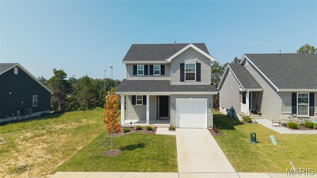 Why wait months for new construction when you can move right into this beautifully maintained, nearly new home? Built just one year ago, this 3-bedroom, 2.5-bath home offers the perfect combination of modern finishes, thoughtful upgrades, and an unbeatable location.

The open-concept main level is designed for today's lifestyle, featuring durable laminate flooring, a spacious living area, and a bright kitchen with 42-inch cabinetry, quartz countertops, stainless steel appliances, a pantry, breakfast bar, and convenient main-floor powder room. Whether you're hosting friends or enjoying a quiet evening at home, this space was made for gathering.

Upstairs, you'll find a spacious primary suite complete with a private bath and large walk-in closet, along with two additional bedrooms, a full bath, and the convenience of second-floor laundry.

The full unfinished basement offers endless possibilities with a bathroom rough-in, sump pump, and plenty of room to create the recreation room, home gym, office, or additional living space you've always wanted.

Step outside to a fully fenced backyard featuring a new 15' x 16' concrete patio—perfect for grilling, relaxing, or entertaining. An attached one-car garage, private driveway, and additional off-street parking mean the upgrades are already done for you.

One of this home's biggest highlights is its incredible location backing directly to Veterans Memorial Park. Enjoy walking trails, a dog park, splash pad, three playgrounds, fishing ponds, soccer and softball fields, and front-row seats to Union's Fourth of July fireworks—all just steps from your backyard.

Located in the sought-after St. Andrews Meadows community, residents enjoy beautifully maintained common grounds, private neighborhood amenities, road maintenance, and a welcoming, family-friendly atmosphere. For added peace of mind, the transferable McBride/PWSC builder warranty includes approximately six months remaining on the first-year warranty, a two-year systems warranty, and a ten-year structural warranty (subject to builder warranty terms).

Just minutes from shopping, restaurants, schools, and everyday conveniences, this move-in-ready home offers the feel of brand-new construction without the wait. Homes in this condition and location don't come along often—schedule your private showing before it's gone!