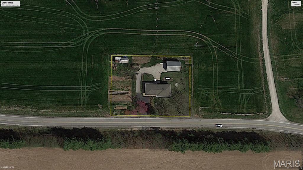 Located just off Hanover Road between Columbia and Waterloo in Monroe County, Illinois, this 1+/- acre property offers an established homesite with an existing 3-bedroom, 2-bath home and several useful improvements. The property combines an existing residence, substantial storage space, and established utilities in a location with convenient access to both Columbia and Waterloo.

The home features approximately 1,400 square feet on the main level, with a full basement bringing the total living area to approximately 2,800 square feet. The basement includes a walk-out patio area, providing direct exterior access from the lower level. The home is ready for your renovations, giving a buyer the opportunity to update the existing space and make improvements based on their plans and preferences.

Additional improvements include an attached garage and an approximately 800+ square-foot shed with a concrete floor. The large shed provides substantial enclosed space for storage, equipment, and tools.

The beautiful homesite sits on Hanover Road between Columbia and Waterloo, providing easy access to both communities. This prime of a location can be hard to find - providing the new buyer with unlimited potential and endless opportunities!