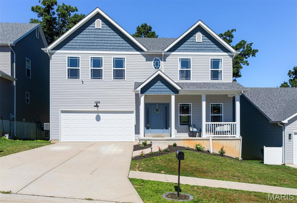 PRISTINE condition!  Over $30K of upgrades, including soaring 9' ceilings!  This almost brand-new home is the larger Prescott model, and it features FOUR spacious bedrooms, all complete with their own walk-in closet!  This gem features a huge covered front porch for maximum curb appeal.  The supersized great room will be the perfect place to gather the whole gang!  The kitchen has a large center island, pantry, and cabinets galore.  Plenty of room for dining in either the eat-in kitchen or the spacious dining room.  The main floor laundry room will eliminate having to head downstairs.  The primary bedroom deserves its own zip code, sporting TWO walk-in closets and a luxurious private ensuite bathroom. The remaining bedrooms are all generously sized, and everyone will love that they all have walk-in closets.  The lower level is a walkout that is ready for your finishing touches.  The new owner will appreciate the privacy of the lot, which backs to trees.   The deck is ready for your BBQ grill, and the large patio is the perfect spot for your hot tub!!  To top it off, it also sits in the sought-after Providence subdivision, which offers a pool, basketball courts, and a park for your family to enjoy.  Call today to tour your new home, sweet home!