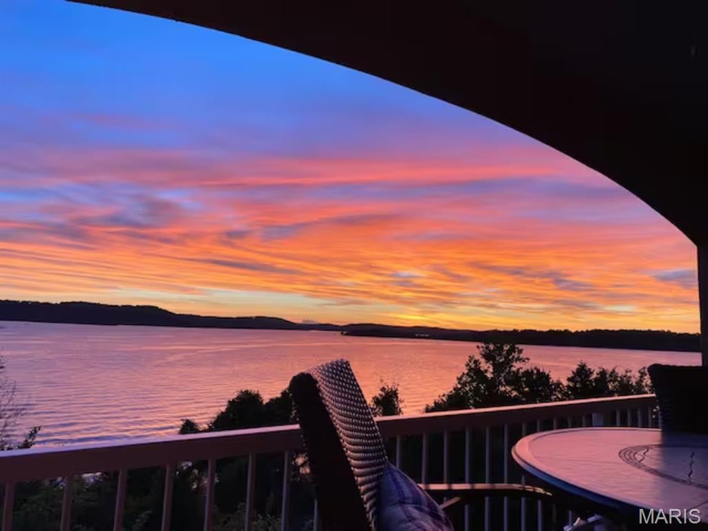 Experience Elevated Lake Living at Its Finest on the Shores of Table Rock Lake! GORGEOUS, LAKE FRONT CONDO with the MOST BREATHTAKING, Panoramic Table Rock Lake Views Stretching Across Sparkling Waters & Painted Skies, the Most SPECTACULAR Sunsets Every Evening! It Would be Almost Impossible to Find Table Rock Living This Close to the Water Anywhere Else. Awake Every Morning to the Sound of Waves Crashing Against the Shore! Enjoy the Lake Upfront & Personal From the Comfort of Your Home. Watch the Boats, From Early Morning Fishers to Tubing/Surfing Into the Sunset. You're in For a Real Treat When the Showboat Cruises by the Condo, a Majestic Site to Behold. IT GETS EVEN BETTER, This is an Active, TurnKey Nightly Rental w Great Rental History, Being Sold Fully Furnished. Perfect for Full Time Living, Vacation Home and/or Investment. Well-Appointed Kitchen w Granite, Beautiful Backsplash & Stainless Appliances, Cozy Stone Woodburning Fireplace, Incredible Lake View From Primary Bedroom & Living Room. Separate Laundry Room w Full Size Washer & Dryer. Lake Harbour is an Intimate Building, Only 16 Units, w It's Own Salt Water Pool, So Never a Crowd Issue. Walk Out Your Door & You're Steps from the Shore, Featuring a Gravel Swim Beach. Walk the Shoreline Forever. Every Evening You are in for an Amazing Sunset Display. The Stars are Just Breathtaking Viewed From the Balcony! Spot Eagles, Herons & a Variety of Waterfowl & Birds All Year Long. Emerald Pointe is a Luxury Gated Community w Quick Hwy Access, Short Drive to Shopping, Dining, Attractions, Medical, Championship Golf Courses, etc. Incredible Community Amenities Include Clubhouse, Pool, Pickleball/Basketball/Tennis Court, Marina w High & Dry Storage, Courtesy Dock, Boat Ramp, Secure/Gated Storage & LakeFront Access. Agent Owned.  Exterior of building is currently undergoing updates.