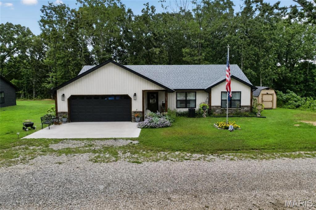 Welcome to 215 Nina St in Dixon, Missouri. Built just a few years ago, this 3-bedroom, 2-bath home offers the advantages of newer construction with modern finishes and a comfortable, functional layout. The interior features an open living and kitchen area with lvp flooring, white cabinetry, stainless steel appliances, a large island, and ample countertop space. The primary bathroom includes a tiled walk-in shower, while the second bathroom offers a modern vanity and tub/shower combination. The home also features a covered front entry, attached garage, concrete driveway, and a spacious yard with established landscaping. Conveniently located in Dixon, this property offers a move-in-ready opportunity for buyers looking for a newer home without the wait of new construction.