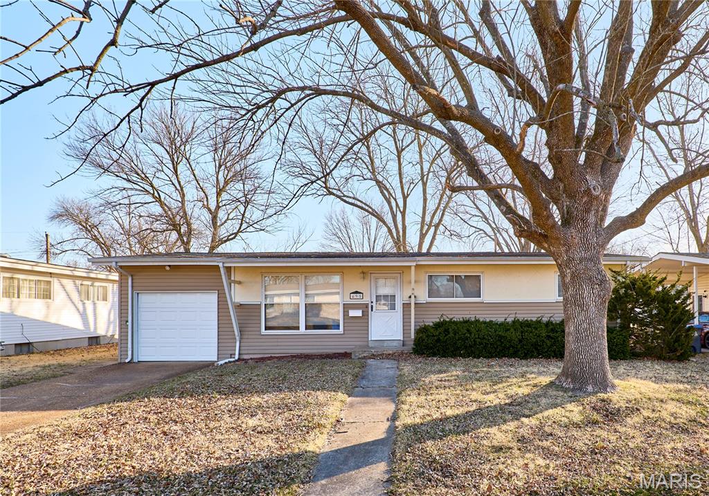 Recently updated 3-bedroom, 1 1/2-bath home on a charming tree-lined street, ready for new tenants! Step inside this move-in-ready ranch and enjoy the open, spacious floor plan, hardwood flooring, and abundant natural light filling the living room. The modern kitchen features sleek appliances, black cabinets, and tile backsplash. This home boasts an extra family room that would work perfect as a movie room, exercise area, or home office. Three generously sized bedrooms and a beautifully tiled bathroom complete the interior. Outside, the large fenced yard and back patio provide the perfect space for entertaining, grilling, or simply relaxing. Pets require approval and additional fees. Don't miss out—this one won’t last long!
