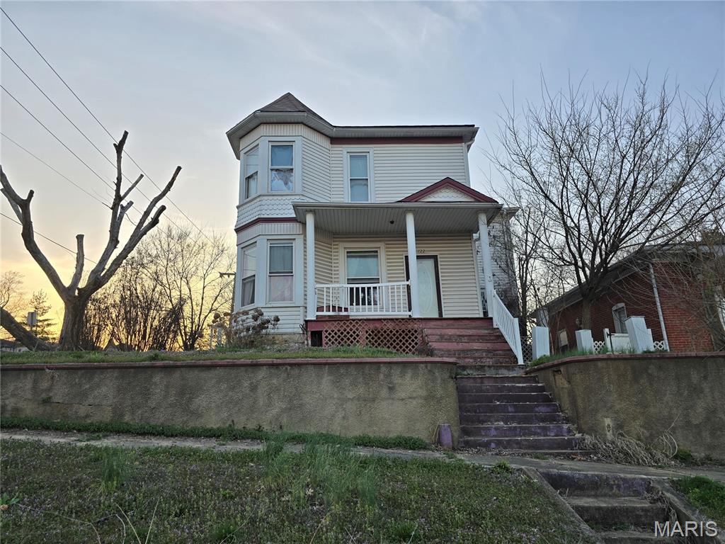 Spacious historic 2-story home full of character and opportunity! With over 2,100 sq ft, this 1920 home offers generous room sizes and a layout ready to be reimagined.
Features include wood floors, tall ceilings, and multiple bay windows that bring in abundant natural light. The main level offers a large living room, dining room, spacious kitchen, and a den/bedroom area, along with main floor laundry and a full bath.
Upstairs includes two true bedrooms and one additional room that could serve as a bedroom, office, or flex space, with access through a bathroom or adjoining bedroom.
Situated on a corner lot with a covered porch, carport, and partial basement for storage.
Property is being sold as-is and will require repairs, but offers incredible potential for renovation, investment, or restoration. A great opportunity to bring this historic home back to life! This is a short sale and any offers will need to be approved by the bank.  Short sales take some time to get approved by bank, so make sure that you have time to wait.
