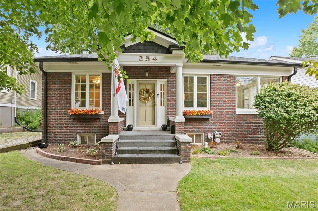 Picture-perfect brick cottage in the heart of Edwardsville! Beautifully maintained and full of charm, character, and curb appeal, this delightful 2-bedroom, 1-bath home features beautiful wood floors, a cozy gas fireplace, updated kitchen, and a bright, sun-filled sunroom—perfect for plant lovers or enjoying your morning coffee.

The unfinished walkout basement offers excellent storage, laundry space, a finished bonus room/office, and plenty of possibilities for additional living, hobby, or workspace. Step outside to the fenced backyard and deck, where a peaceful, private setting provides the perfect place to relax, entertain, or enjoy watching the deer that frequent the property.

Ideally located just minutes from the dog park, splash pad, farmers market, shops, restaurants, trails, schools, and everything downtown Edwardsville has to offer. Charming, comfortable, and wonderfully located—this is a truly special place to call home.