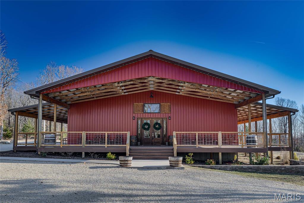 An exceptional opportunity to own a fully established, turnkey wedding and event venue set on 10 private, wooded acres. Known as Wild Coyote Ranch, this newer construction venue was built in 2021 and offers modern systems, updated finishes, and thoughtfully designed spaces throughout, allowing you to step into ownership with confidence and minimal startup work.

The expansive main event hall features soaring ceilings, exposed wood trusses, polished concrete floors, and warm natural finishes that create an unforgettable atmosphere. Overlooking the main event space is a loft that adds dramatic character and flexibility, complete with two dedicated storage rooms. The venue also offers a fully equipped commercial kitchen, two restrooms, two private get-ready rooms, and a dedicated utility/janitorial room designed for smooth event operations.

Outside, guests are welcomed by a beautiful wooded ceremony area with benches already in place, creating a peaceful and private backdrop for events. The building is enhanced by long covered porches along the front and both sides, spanning the full length of the venue and offering generous space for guests to gather, mingle, and enjoy the setting. The property also provides ample on-site parking, easily accommodating large gatherings and event traffic.

This property is being sold 100% turnkey. Everything you see conveys with the sale, including all commercial kitchen equipment, venue tables and chairs, décor and inventory stored on site, furniture in the get-ready rooms, ceremony benches, and more. Starlink internet equipment is also included, providing reliable connectivity in a serene, rural setting.

Whether you’re launching your first venue or expanding an existing event business, this newer, fully equipped property offers a rare opportunity to begin hosting events immediately in a well-known and beautifully maintained setting.