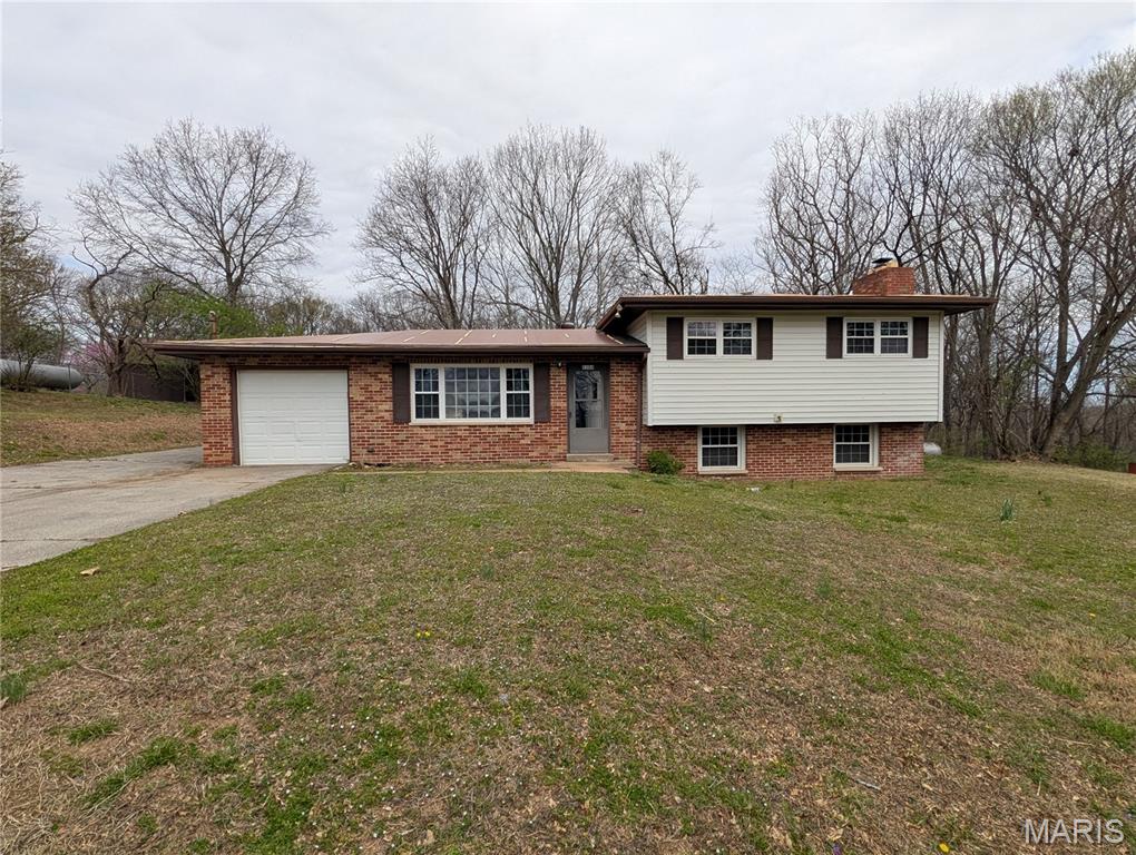 Spacious 3 bed, 1.5 bath mult-level home with partially finished walkout basement on approx 1 acre.  Home has an estimated 1500sf of living area.  Kitchen has newer 42" cabinets with solid surface countertops, newer flooring, and recent paint.  HVAC and water heater are newer. Some other work is needed to make this a great home.   This is a must See Home! An AGENT MUST BE PRESENT FOR ALL SHOWINGS. Do not Trespass.