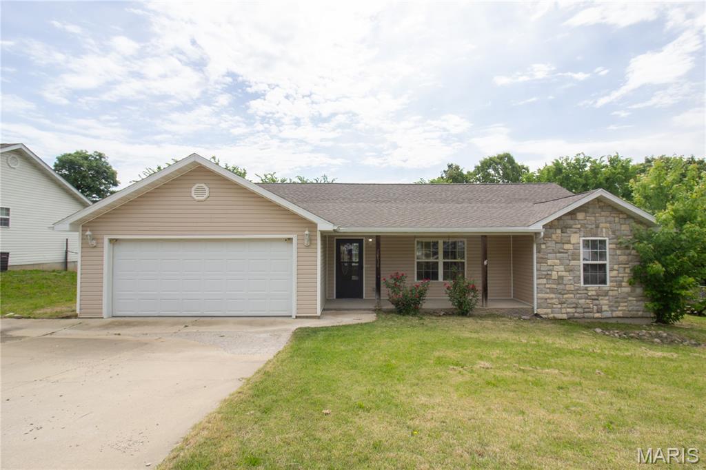 Tucked into the Crismon Dev neighborhood just minutes from the main gate of Fort Leonard Wood, this well-kept 2006 ranch delivers comfortable, single-level living in a location that's hard to beat for military families, commuters, and investors alike.
Inside this 3 bedroom/2 Bath, 1,311 sq ft layout, you'll find a true split floor plan, the private primary suite sits on one side with a walk-in closet, double vanity, and full bath, while two additional bedrooms and a second full bath occupy the opposite side, giving everyone their own space. The heart of the home is an open kitchen-and-dining combo that flows into a living room crowned with vaulted ceilings and warmed by a propane fireplace. It feels bigger than its footprint and lives easy.
Step outside to a fully fenced backyard on a gentle-sloping  lot, room for playing, pets, gardening, or just unwinding on the back deck. The deck features an awning. 
Whether you're PCSing to Fort Leonard Wood, looking to add a solid rental to your portfolio, or buying your first home, 20834 Hibbett Road is a low-maintenance ranch in a convenient location at an approachable price.
