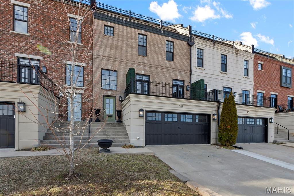 This townhome delivers a rare blend of luxury, space, and unforgettable Mississippi River views. Positioned in the heart of downtown of Cape Girardeau, every level offers a front-row seat to the river and city energy below. Spacious rooms, high-end finishes, and thoughtful design make this home truly move-in ready. Architectural details like soaring ceilings, elegant columns, French doors, and private balconies create a refined yet inviting atmosphere throughout. The kitchen is designed to impress with Beussink custom cabinetry, a generous island, and a walk-in pantry-perfect for entertaining or everyday living. This is a rare opportunity to own a distinctive property with views, location, and luxury all in one. Schedule your showing and experience it for yourself.