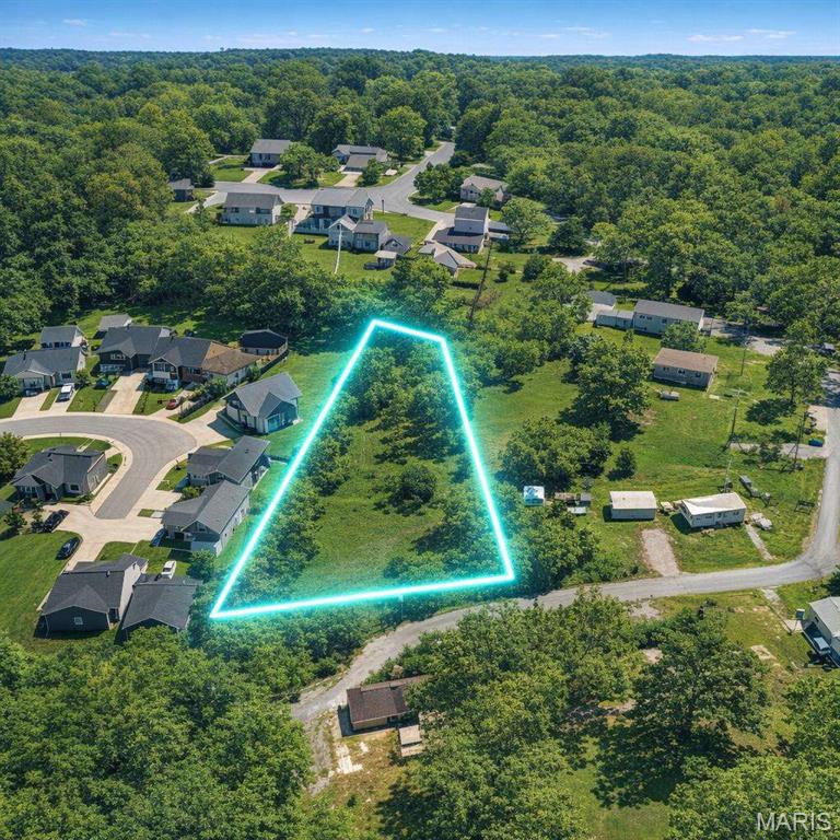 1.18-acre buildable vacant lot in the established Hickory Dale Addition subdivision, located in the Francis Howell R-III School District (one of St. Charles County's top-rated districts). Lot is 220 ft wide by 368 ft deep, in unincorporated St. Charles County. Inside the Duckett Creek Sanitary District service area; sewer connection requires either a private lateral with easement from the adjacent property owner, a sewer main extension along Labonte Dr, or septic installation -- DCSD service availability letter and engineer correspondence on file and available on request. Water service via Missouri American or private well (buyer to verify; not in PWSD #2 service area). No HOA. Drive-by anytime.