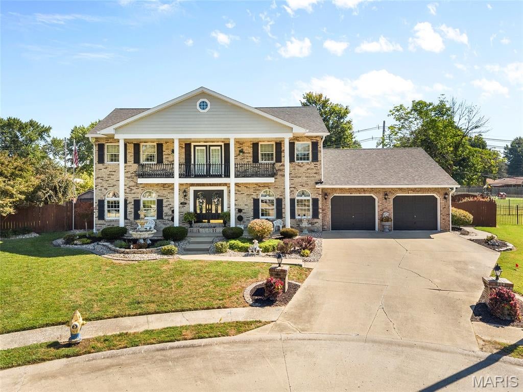 STUNNING LUXURY TWO-STORY ESTATE with resort-style backyard.  Impressive from the moment you arrive, this exceptional residence offers sophisticated style, generous living spaces, and an incredible outdoor retreat.  Impeccably landscaped front and back yards with irrigation system serving both front and back yards, and charming upper level balcony create outstanding curb appeal.  The grand foyer welcomes you with a striking split staircase and elegant open design.  The main level features a formal dining room, spacious eat-in-kitchen with breakfast bar and an additional breakfast room.  The dramatic living room showcases soaring vaulted ceilings and a beautiful stone fireplace, creating the perfect setting for everyday living and entertaining.  A luxurious main-floor primary suite offers wood flooring and a spa inspired complete bath with dual vanities, separate shower and soaking tub.  A private office and main-floor laundry add convenience and functionality.  The upper level provides four spacious bedrooms, an open balcony overlooking the main living area, and a full bath ideal for family and guests.  The expansive lower level takes entertaining to another level with a second kitchen and seating area, spacious family/game room, gym, full bath, 2nd fireplace and plenty of storage.  Step outside to your own private oasis.  The beautifully landscaped, cedar fenced back yard features a pool, hot tub, expansive deck and patio perfect for entertaining or unwinding in complete privacy.  Dual hvac system and termite maintenance by Rottleir.  Buyer and buyers agent to verify all information as it is gathered from various sources.  Square footage is approximate but believe it is larger.  Landscape decor/ornaments, firepit, basement gate does not stay.  Pool and hot tub are working but not guaranteed.  Ring -audio/video in use.