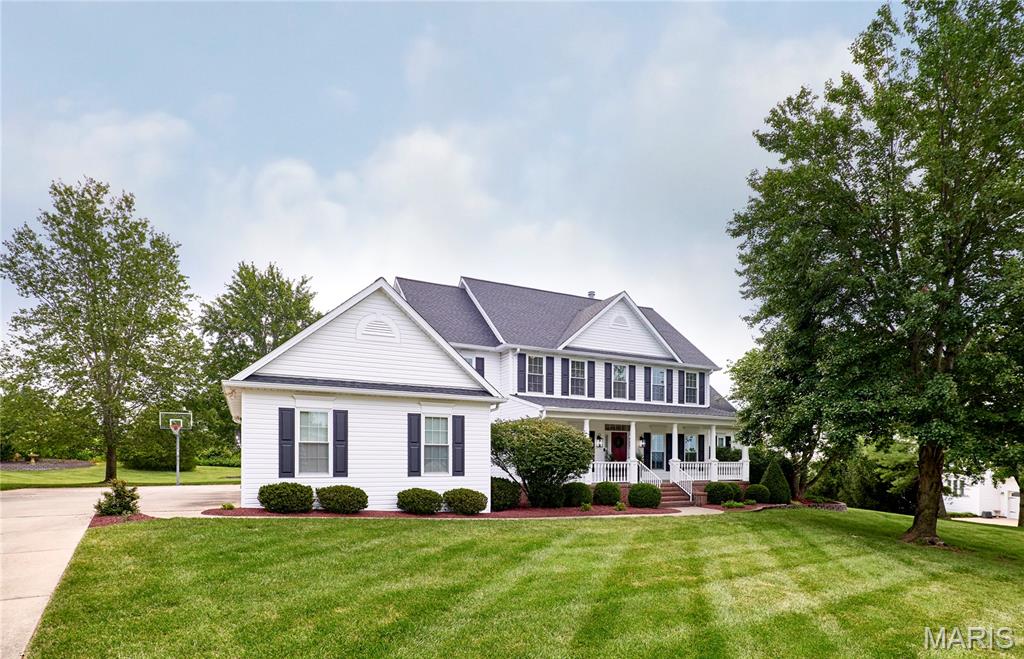 Southern Colonial-inspired 4+ bed, 6 bath 1.5-story on a 1-acre cul-de-sac lot in desirable Camelot. The great room features a soaring 2-story bay window, brick fireplace, and custom built-ins, opening to a terraced paver patio and park-like yard with firepit. Designer kitchen includes 42” custom cabinets, granite counters, Dacor/Bosch appliances, and walk-in pantry. Thoughtful vaulted hearth room addition with stone fireplace, study, and full bath. Main-floor primary suite features a vaulted sitting area and a stylishly updated bath with new shower, polished nickel fixtures, recessed lighting, and classic jetted tub. Upstairs: 3 bedrooms—one en-suite, two Jack & Jill—with updated baths and bonus room. Finished LL includes rec room, wet bar, wine closet, full bath, and storage. 3-car garage with workspace, oversized driveway. Many recent updates: roof, carpet, windows, dishwasher & more. Prof. photography 7/29. Showings begin 8/1.