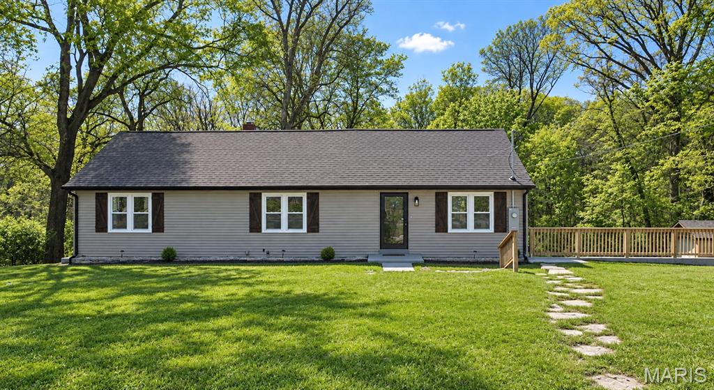 Back on the market at no fault of the seller! Don't let the days on market fool you. This is a rare opportunity to own a beautifully rebuilt home on 2.8 acres in Maryland Heights.

Imagine enjoying the privacy of country living while being just minutes from Creve Coeur Park & Lake, shopping, restaurants, and all the conveniences of the city. This property offers that unique combination of space, privacy, and location that is so hard to find.

The home has been fully gutted and restored to offer a new construction feel with thoughtful finishes throughout. From the new roof, exterior and interior doors, and energy efficient windows to the new plumbing and upgraded 200 amp electrical service with all new wiring, the major work has been done.

Inside, the custom finishes create a warm, inviting atmosphere that feels both beautiful and functional. You’ll love the open flow, high ceilings, and stunning fireplace in the living room. The spacious kitchen features custom cabinetry, quartz countertops, and all new Café appliances, including a built-in microwave and hood.

The main floor primary bedroom offers double doors, double closets, and access to a versatile upstairs loft, perfect for a home office, dressing room, playroom, or additional sleeping space. Two additional bedrooms and a full bathroom complete the main level, along with a convenient half bath.

The lower level offers even more potential with a walkout, abundant storage, and the opportunity to create additional finished living space.

Outside, the brand new 16' x 20' deck with double staircases makes it easy to enjoy the expansive backyard. With 2.8 acres, wooded views, gardening space, and plenty of room to create your own outdoor retreat, the possibilities are endless. The attached two car garage and outbuilding add even more functionality.

And the location? Parkway School District, minutes from Creve Coeur Park & Lake, Maryland Heights Community Recreation Center, shopping, restaurants, and quick highway access.

This is the kind of home where you can feel proud to have guests over, enjoy your own private space, and still be close to everything you need.

A truly special property that offers the best of both worlds: modern living, exceptional privacy, and a location that’s hard to beat. Come see it for yourself!