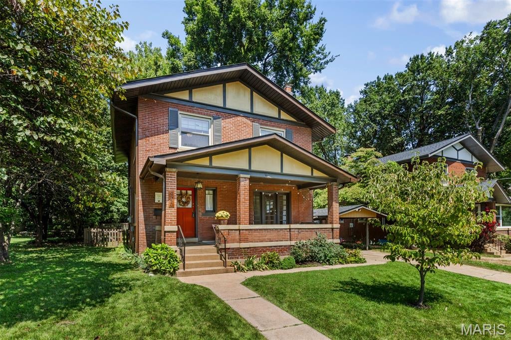 Step back in time and enjoy this gorgeous City of Ferguson Century Home! Located in the heart of historic downtown Ferguson. Extensive updates enhance the original hardwood flooring that extends throughout the home. Period millwork, crown molding, stained glass windows, high ceilings and a beautiful T-staircase set the stage for this warm, inviting home. The updated kitchen features: stainless appliances, including electric smooth surface induction range, dishwasher, microwave, garbage disposal, hands-free faucet and refrigerator, which is included. Granite counters and backsplash enhance the beautiful cabinetry. The main floor has a spacious living room with French door opening to covered porch, formal dining room, kitchen and half bath. Upper level offers 4 bedrooms and a luxurious new (8/2026) full bath with subway tile surround in the shower/tub, octagon porcelain tile flooring, new sink, plus updated plumbing, lighting, mirror and spacious linen closet for storage. The basement has a bonus room, semi-finished with cedar paneling with mounted projector included. Abundant storage space is available with built-in wood shelving. Laundry is in the basement. Walk-out opens to back yard. Yard is level with fully fenced cedar fence installed in 2022. Shed is included! Additional features include small mud room off kitchen to back yard, new roof and gutters 9/2024, French drain installed in 2020, radon mitigation system, insulated tilt in windows throughout, zoned heating/cooling, smart home security system and pre-wired for Electric Vehicle charger. Exterior amenities include concrete driveway with carport and fabulous covered front porch to relax and enjoy the extensive landscaped gardens. Experience living in a walkable community, close to downtown dining, seasonal farmers' market, shopping, coffee shop, the library, and so much more!