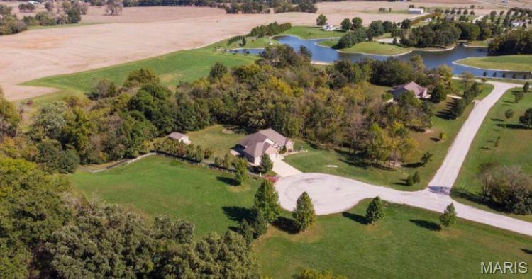 Build your dream home on this 3 acre homesite located on a quiet cul-de-sac in the beautiful Lake Raymond subdivision. Less than 5 minutes from I-70 it has easy access to the Metro area or Greenville. Enjoy all the amenities of a subdivision (manicured lawns, well maintained streets, a shared lake, street lights, mature trees, private walking trails) without the hassel of town living. This site back to trees and provides privacy as well as a country feel.
