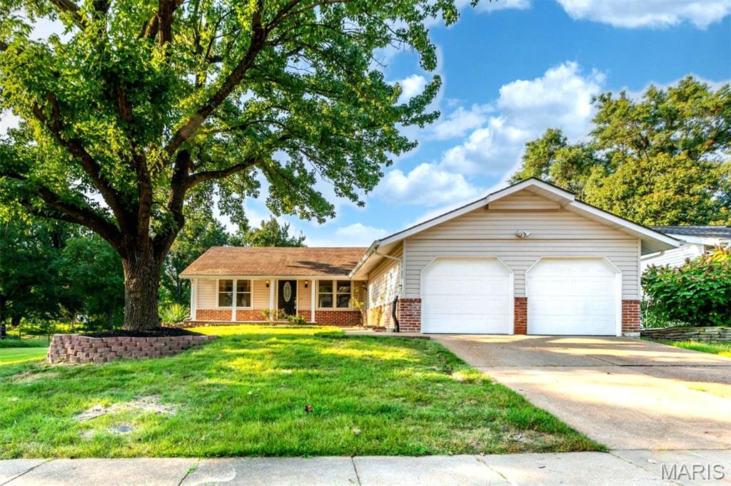 Welcome to this beautifully updated home in the desirable Parkway North School District! Offering a comfortable and versatile floor plan, this residence features attractive wood-grain flooring, fresh finishes, and an abundance of living space. The updated kitchen shines with new stainless steel appliances, ample cabinetry, and generous counter space, making everyday living and entertaining a breeze. The living room features a decorative wood-burning fireplace, creating a warm focal point and inviting atmosphere. The finished lower level provides valuable additional living space—perfect for a recreation room, home office, gym, or media area. Outside, the home offers classic curb appeal with durable vinyl siding, mature landscaping, and a spacious two-car garage. With its recent updates, flexible living spaces, and convenient location within the Parkway North School District, this home is truly move-in ready and ready to welcome its next owner!