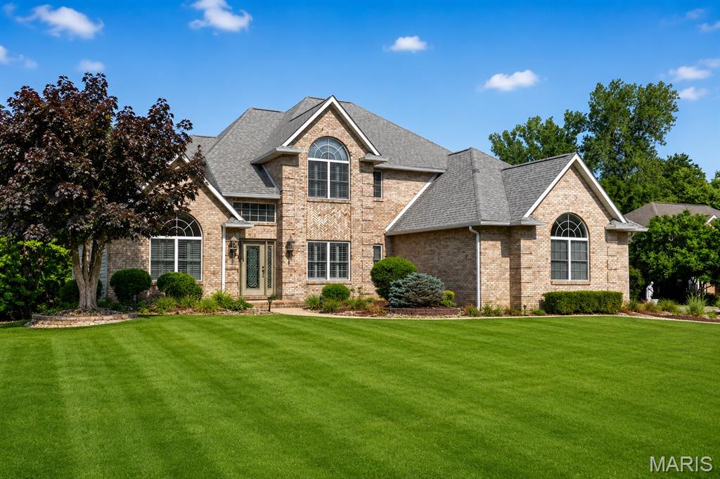 Luxury, space, and timeless craftsmanship come together in this stunning story-and-a-half home located in one of Maryville's most desirable neighborhoods. Offering nearly 5,000 square feet of finished living space, this impressive residence features 5 bedrooms, 5 bathrooms, and a 3-car garage, all situated on a spacious lot with plenty of room for your dream pool.

The striking all-brick front elevation welcomes you into a home designed for both everyday comfort and elegant entertaining. The soaring 16-foot vaulted ceilings in the great room create a dramatic focal point, highlighted by one of two gas fireplaces and abundant natural light. A beautiful see-through fireplace adds warmth and ambiance between living spaces, while French doors provide character and sophistication throughout.

The chef's kitchen is equipped to impress, offering generous workspace, abundant cabinetry, and an ideal layout for hosting family and guests. Adjacent to the kitchen, the formal dining room provides the perfect setting for holiday gatherings and special occasions.

The highly sought-after main-floor primary suite offers privacy and convenience, while the main-floor laundry room makes daily living effortless. Upstairs and throughout the home, you'll find spacious bedrooms and well-appointed bathrooms designed to accommodate family and guests alike.

The finished walkout basement expands your living and entertaining options with a spacious recreation area, additional living space, and a quality 9-foot foundation pour that enhances the home's open feel. Step outside to enjoy the relaxing screened-in porch, overlooking the backyard with ample room for outdoor living, recreation, and a future pool.

Combining exceptional craftsmanship, generous living spaces, and premium features, this upcoming Maryville gem is a rare opportunity you won't want to miss.

5 Bedrooms | 5 Bathrooms | 3-Car Garage | Nearly 5,000 Finished Sq. Ft.