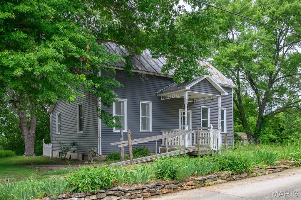 Welcome to 765 Main Street in Morrison, MO - a charming property located just a short drive from the historic town of Hermann. This inviting 3-bedroom, 1-bath home offers small-town living with thoughtful outdoor spaces and plenty of room for hobbies, gardening, and storage. 

The property features a spacious 2-door detached shop, perfect for a workshop, vehicles, or extra storage, along with two additional small garden sheds for all your outdoor needs. Enjoy the beauty of established landscaping with mature flowerbeds and established asparagus plants ready to welcome each growing season. 

Whether you're looking for a peaceful place to call home, room to pursue your favorite hobbies, or a property with character and charm, 765 Main Street offers a wonderful opportunity in the heart of Mid-Missouri.