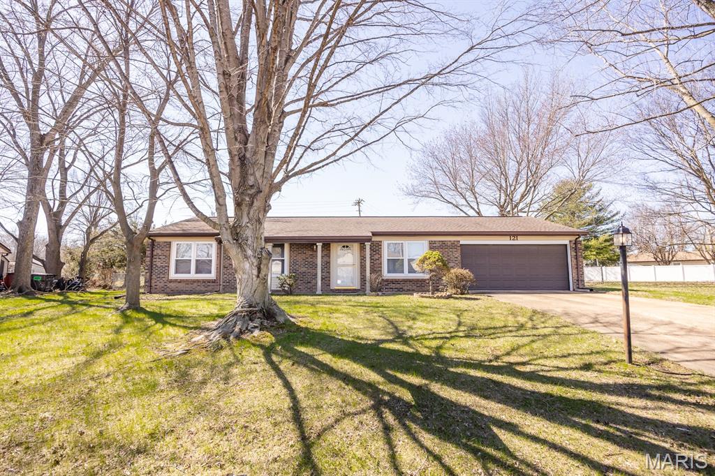 Fantastic location and spacious living await in this well-maintained Mascoutah home! Situated on a large fenced lot, this charming 4-bedroom, 1.5-bath residence with a 2-car garage offers comfort, functionality, and wonderful spaces for everyday living and entertaining.  A quiet circular drive welcomes you to the property and provides convenient access and curb appeal. Step inside to a bright and inviting living room filled with natural light, creating a warm and welcoming atmosphere as you enter the home. The living area flows easily into the kitchen, making it ideal for both daily living and gatherings with family and friends. The functional kitchen offers plenty of space for meal preparation, cooking, and casual dining, along with ample cabinetry for storage. All appliances will remain with the home, including the washer and dryer conveniently located just off the kitchen, adding to the home’s practicality and ease of living.  One of the standout features of this property is the beautiful four-seasons room. This light-filled space offers expansive views of the private, fenced backyard and provides the perfect setting for year-round enjoyment. Whether you're relaxing with your morning coffee, hosting guests, or simply enjoying the peaceful outdoor views, this versatile space will quickly become a favorite gathering spot. Back inside, the home features three comfortable bedrooms, including a generously sized primary bedroom. three additional bedrooms provide flexible space for family members, guests, or even a home office. The unique bathroom configuration offers both a full bath and a separate half bath, providing convenience and functionality for busy households. Outside, the large fenced yard offers plenty of room for outdoor activities, gardening, pets, or future landscaping ideas. With its great location, thoughtful layout, and well-cared-for condition, this home presents a wonderful opportunity for its next owner.  Don’t miss your chance to make this charming Mascoutah property your own. Buyer to verify all information.