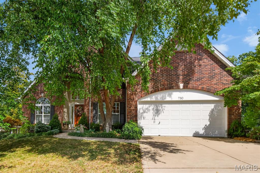 Tucked away on a quiet street in O’Fallon, this beautifully maintained and thoughtfully updated 4-bedroom, 3.5-bath home offers something increasingly hard to find—a truly private backyard retreat surrounded by nature. Backing to heavy woods and land that will never be built on, the setting feels peaceful and secluded, making it easy to forget you are even in a neighborhood.
Inside, an open and spacious floor plan is enhanced by soaring vaulted ceilings, rich hardwood flooring, and beautiful views of the wooded backyard. The dramatic two-story great room features a gas fireplace flanked by floor-to-ceiling windows, filling the space with natural light and bringing the beauty of the outdoors inside. It flows seamlessly into the breakfast room and updated kitchen, where vaulted ceilings continue overhead. The kitchen is beautifully appointed with granite countertops, a center island, tile backsplash, stainless steel appliances, under-cabinet lighting, and easy access to both the breakfast room and formal dining room with cathedral-vaulted ceilings.
The main-level primary suite is a private retreat of its own, featuring French doors, a wall long bay window overlooking the backyard, a spacious walk-in closet, and an updated ensuite bath with dual sinks, a seated vanity area, corner whirlpool tub, and separate tiled shower with dual shower heads. A sitting room and powder room complete the main level.
Upstairs, you’ll find two additional bedrooms, both with walk-in closets, a full hall bath, and a loft overlooking the great room with space ideal for a home office or reading nook.
The finished walkout lower level adds an incredible amount of flexible living space, with room for a family room, exercise area, hobby or craft space, and more. A fourth bedroom, beautifully updated full bath, and laundry room complete the lower level. Walkout doors lead directly to a screened in porch and an inviting stamped concrete and flagstone patio, extending your living space outdoors.
And the backyard...it is truly something special. Meticulously designed and cared for over the years, this private oasis is filled with extensive landscaping, mature shrubs, flowering perennials, daylilies, peonies, Japanese maples, a dogwood tree, ground cover, and seasonal color throughout much of the year. An herb garden with both perennial and annual plantings adds another charming touch. The fenced yard, irrigation system, wooded backdrop, and extensive landscaping create a colorful, peaceful retreat where you can relax, entertain, or simply enjoy being surrounded by nature. A deck with a pergola provides yet another beautiful spot to enjoy the secluded setting.
Newer roof and siding (2024), a quiet location tucked toward the back of the circle, and convenient access to Hwy 70 add even more to love about this exceptional home. Beautifully updated, exceptionally cared for, and surrounded by a backyard setting that feels like your own private escape—this is one you won't want to miss.