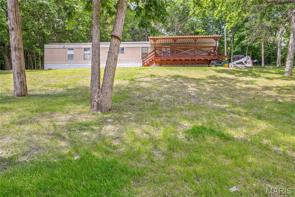 Discover the inviting lifestyle awaiting you at 4809 Miller RD, HSSPRNGS MO 63051. Built in 1979, this ready-to-move-in mobile home offers a comfortable retreat with two bedrooms and two bathrooms, providing a perfect blend of convenience and charm. The kitchen is designed for both functionality and social interaction, featuring a peninsula that provides ample counter space for meal preparation and casual dining. Each of the two bathrooms offers the convenience of two sinks, streamlining morning routines and providing a sense of spaciousness. Further enhancing the home's appeal is a dedicated laundry room, simplifying household tasks. Step outside to enjoy the covered deck, an ideal space for relaxation or entertaining, regardless of the weather. This property offers an exceptional opportunity to embrace a comfortable and convenient living experience.
