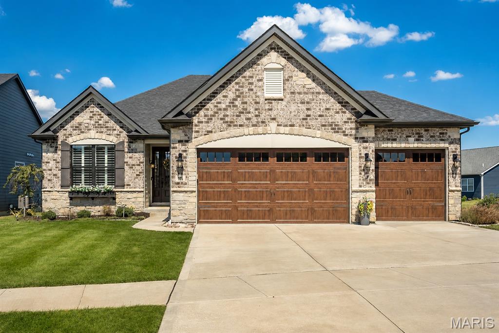 Better than new! This beautifully maintained 4 year old home has all the things you want in a newer home, PLUS the thoughtful upgrades and finishes that have already been done for you. Step inside and the main level immediately makes an impression with 11' ceilings, tall doors, crown molding, tray ceilings, transom windows and new LVP flooring installed in 2025. The great room was extended an additional 4' for even more room to gather and features a beautiful gas fireplace that makes the space feel extra inviting. And then there’s the kitchen…the high-end gourmet kitchen is a showstopper with stainless steel appliances, double oven, soft-close cabinetry, convenient rollout drawers and a gorgeous stone surround that creates a true focal point around the 5-burner gas cooktop. The new GE Cafe refrigerator, added in 2026, is just another one of those upgrades you’ll love. The main floor primary suite is spacious and feels like a retreat, with a tray ceiling and a beautiful primary bath featuring a walk-in shower, adult-height vanity with custom cabinetry, linen closet and walk-in closet. Two additional bedrooms, a full bath, main floor laundry and separate drop zone off the garage complete the main level. 3" plantation shutters, custom window treatments and motorized shades add the perfect finishing touches throughout. And wait until you see the backyard! Step outside to the screened-in porch and patio overlooking a beautifully landscaped, fully fenced yard...the perfect setup for morning coffee, entertaining or just enjoying your own space. James Hardie siding is another premium upgrade, adding durability and peace of mind for years to come. A 3-car garage gives you plenty of room for parking and storage, while the unfinished lower level offers tons of potential with an egress window and rough-in for a future bedroom & bathroom along with tons of shelving. Since the 2022 build, the sellers have added so many thoughtful upgrades including landscaping, fencing, screened porch, plantation shutters, custom window treatments, motorized shades, mounted TVs and even a charming window box on the front of the home. This is one of those homes that feels like you’re getting the best of both worlds...newer construction without having to wait and pay for all the extras. It truly is better than new!